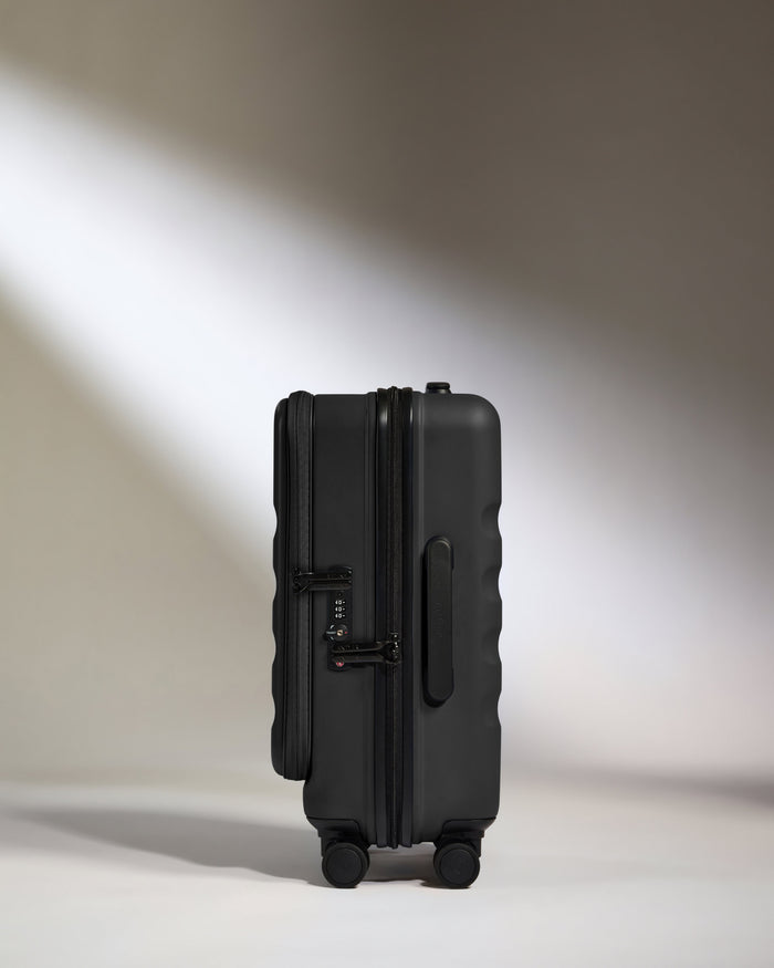 a black suitcase on wheels