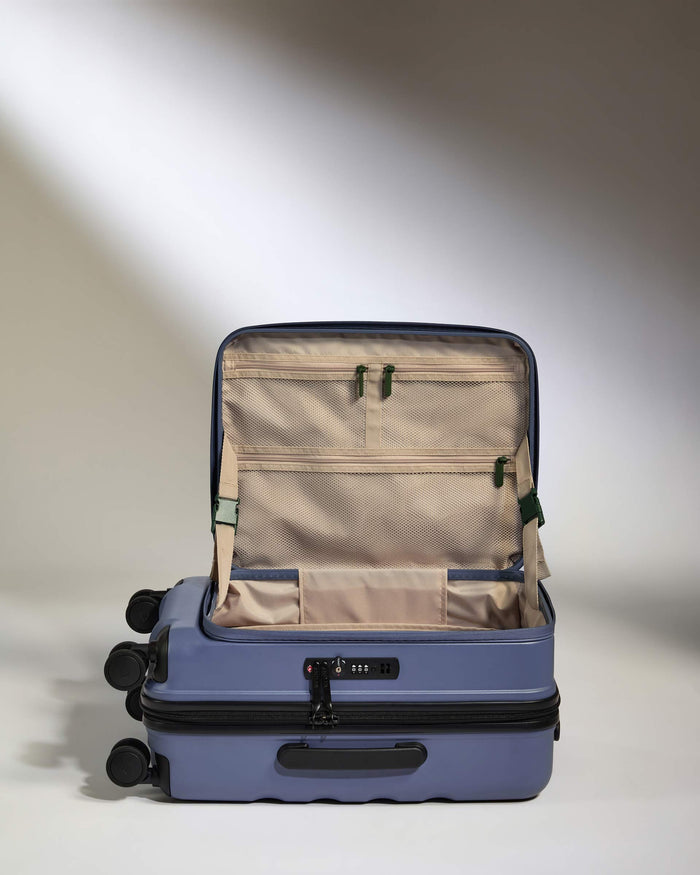 a blue suitcase with wheels