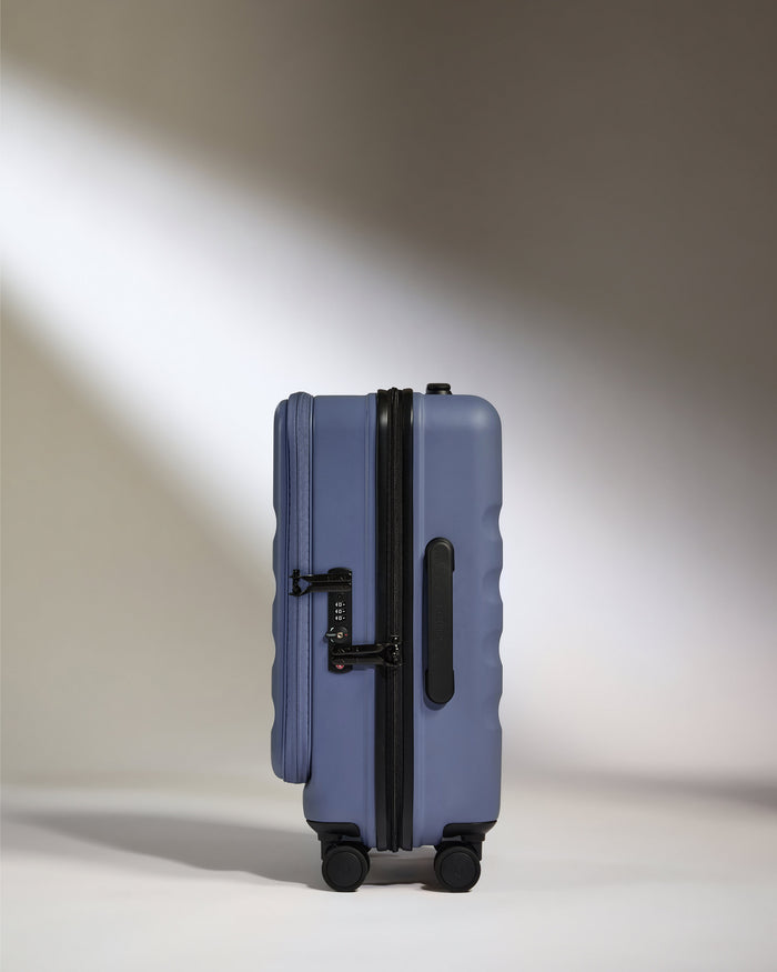 a blue suitcase with wheels