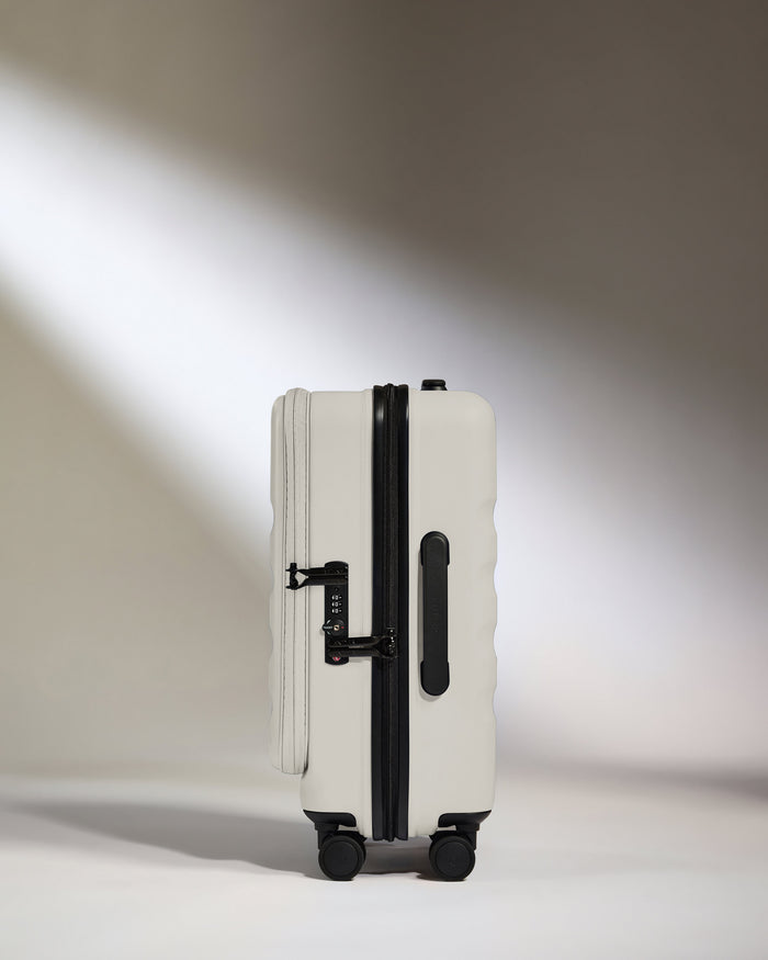 a white suitcase with wheels
