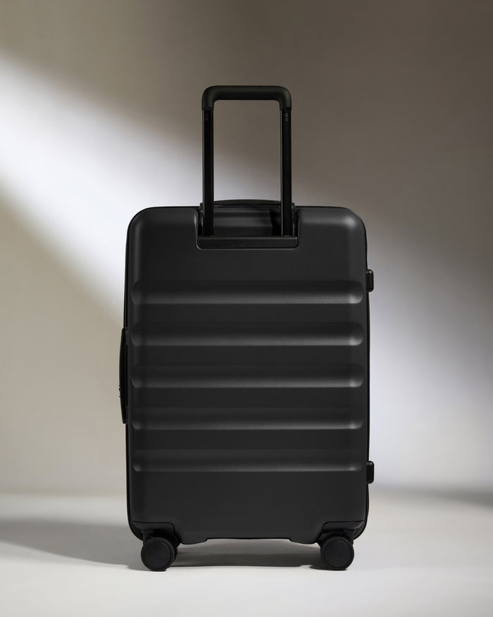 a black suitcase with wheels
