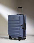 a blue suitcase with wheels