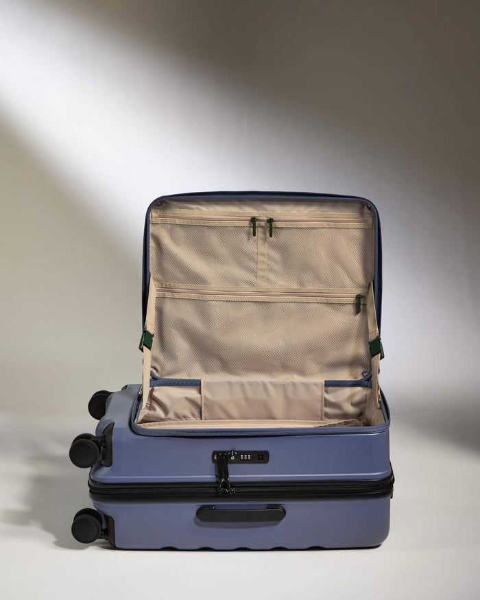 a blue suitcase with wheels