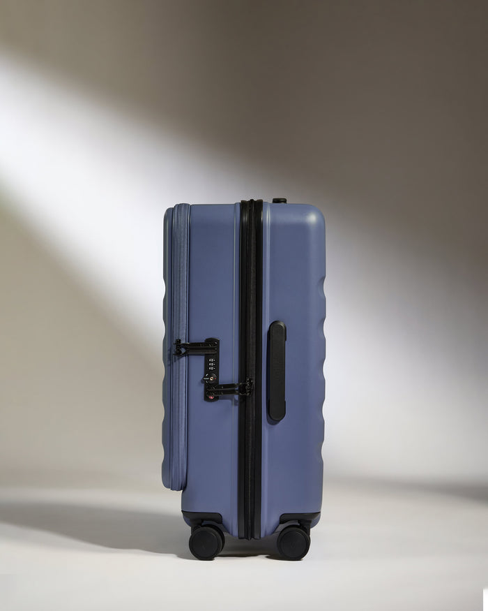 a blue suitcase with wheels