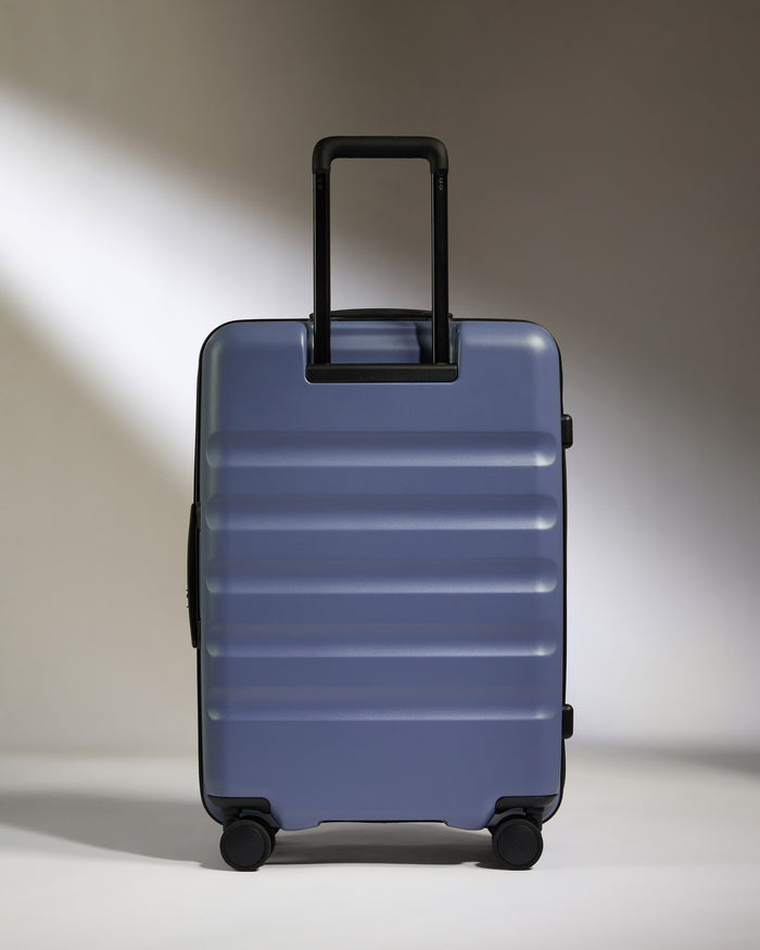 a blue suitcase with wheels
