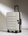 a white suitcase with wheels