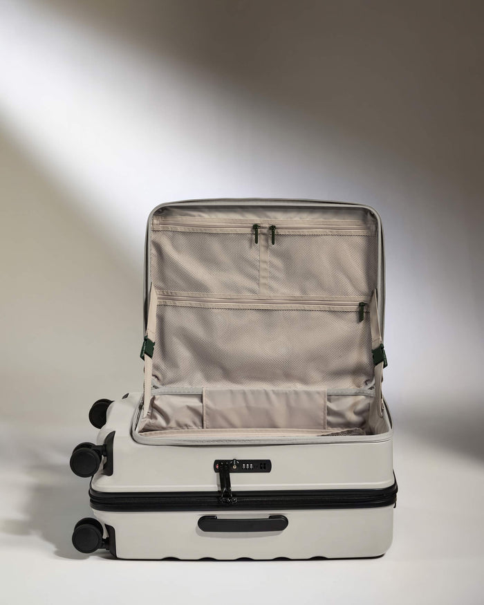 a suitcase with wheels and a light shining on it