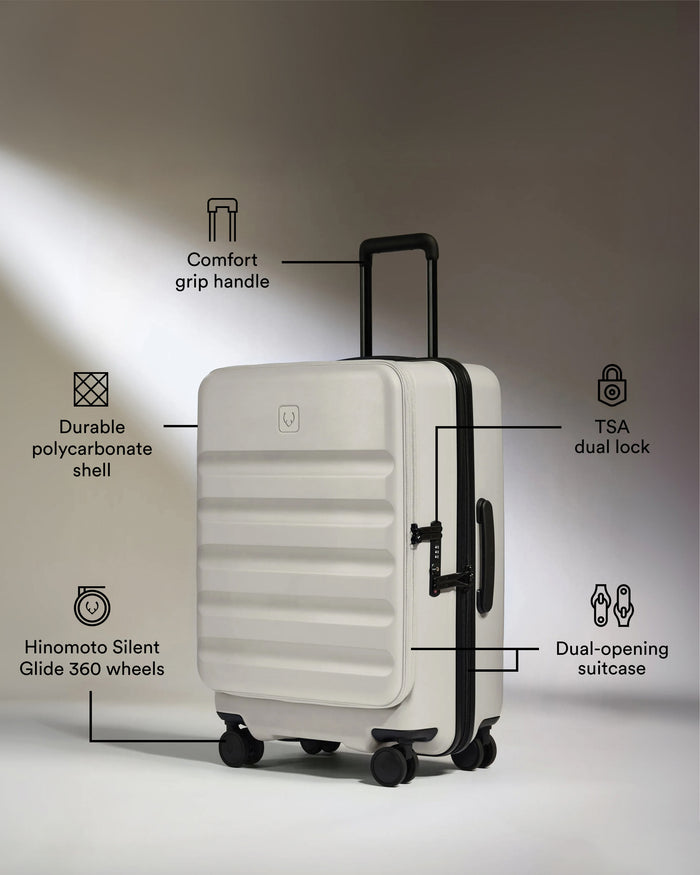 a white suitcase with black handles