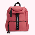 Dusty rose Lulu Guinness backpack with black straps and zipper pulls.