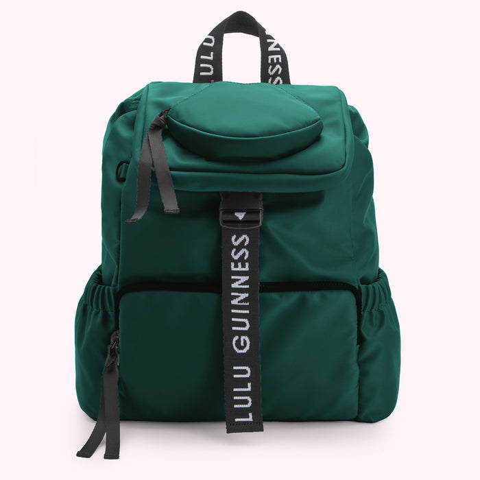 Green Lulu Guinness backpack with black straps and logo.