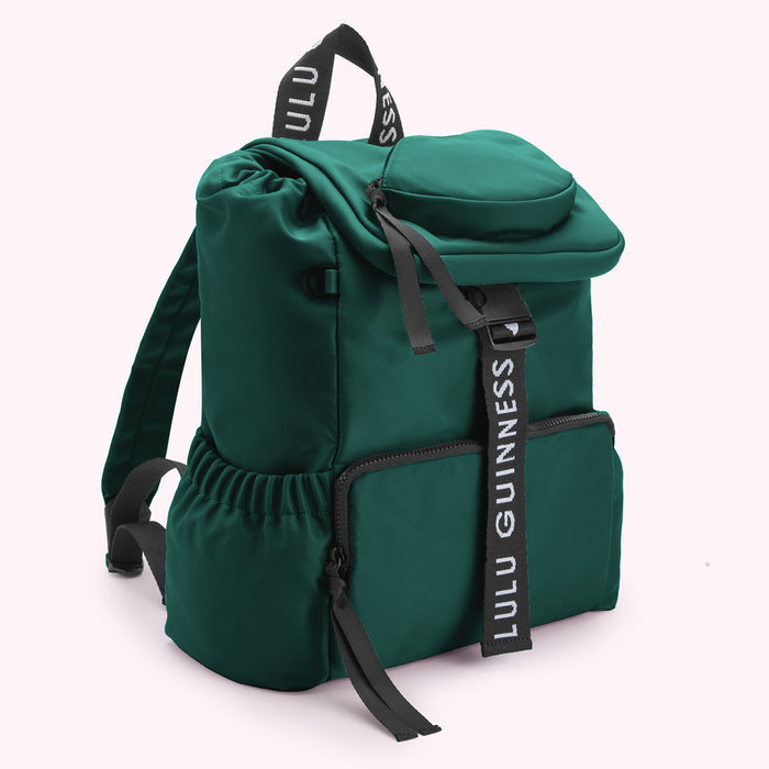 Green Lulu Guinness backpack with black logo straps.