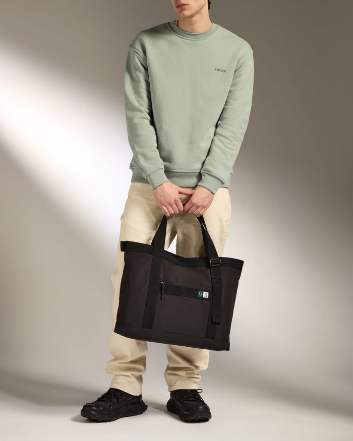 a man holding a bag