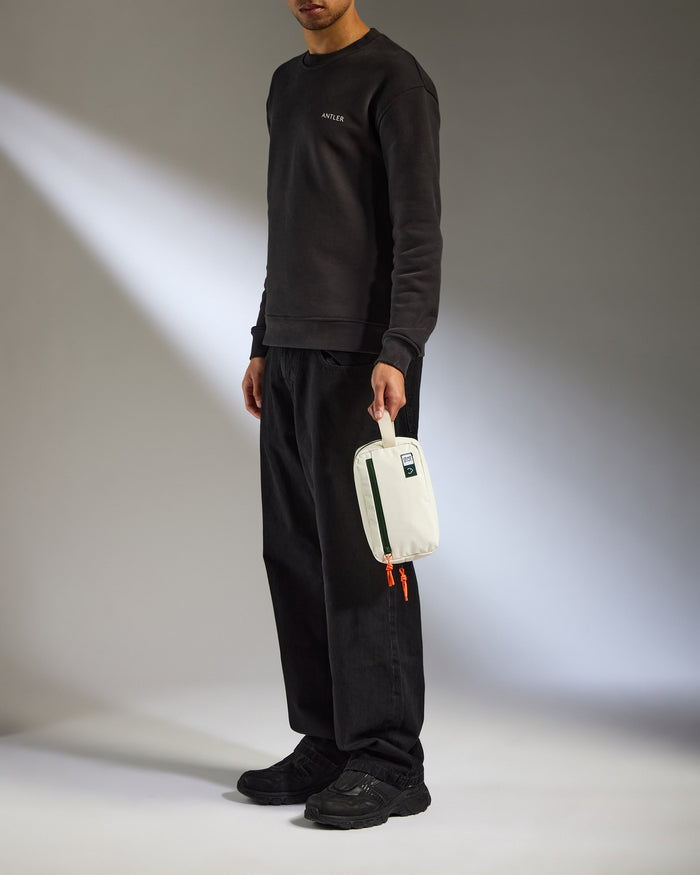 a man holding a white bag