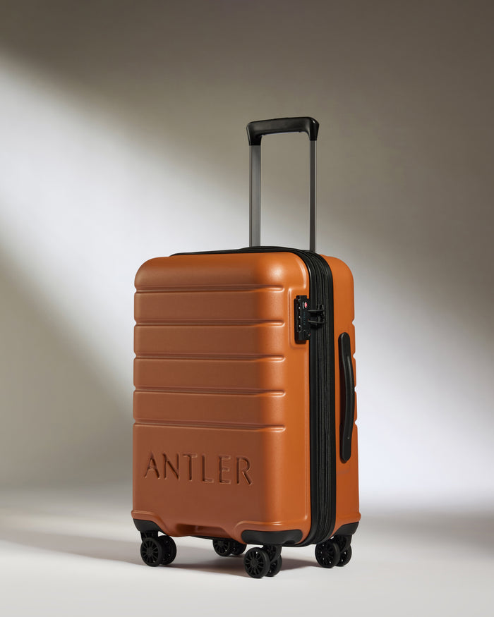 a brown suitcase with wheels