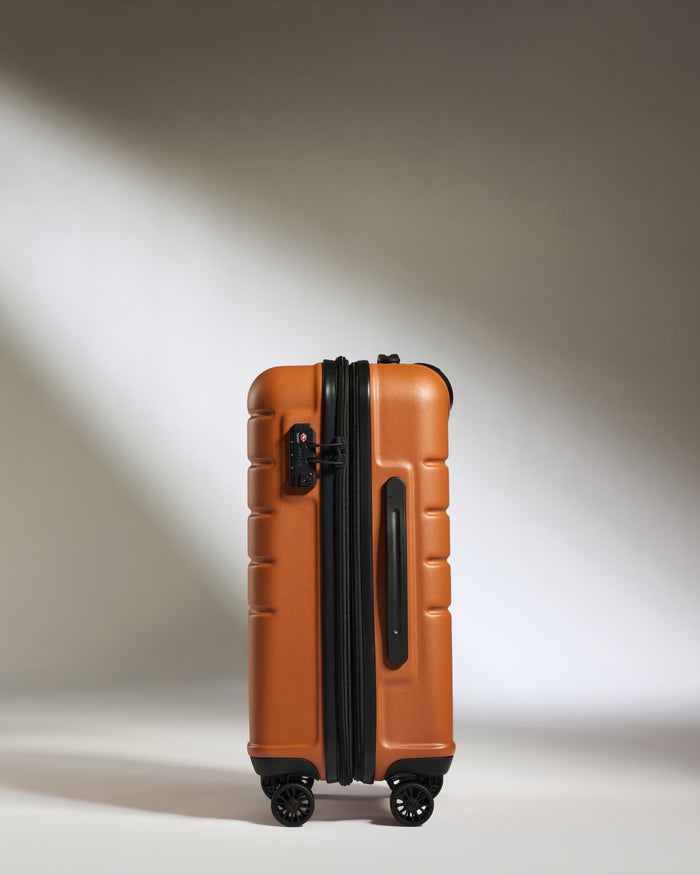a suitcase on wheels with light shining on it