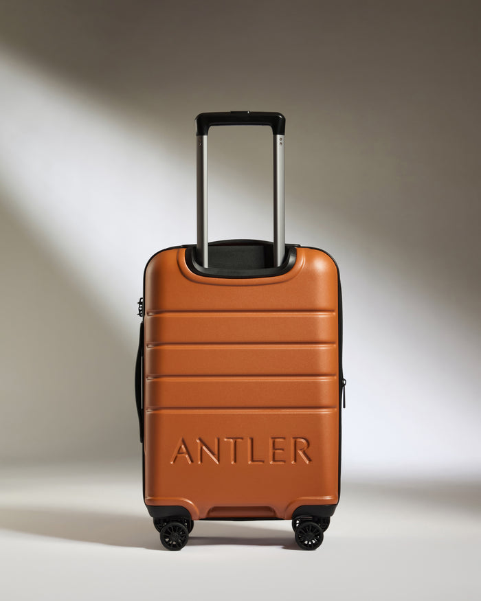 a brown suitcase with handle