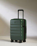 a green suitcase with wheels