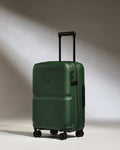 a green suitcase with wheels