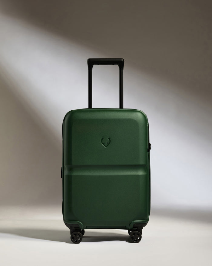 a green suitcase with wheels