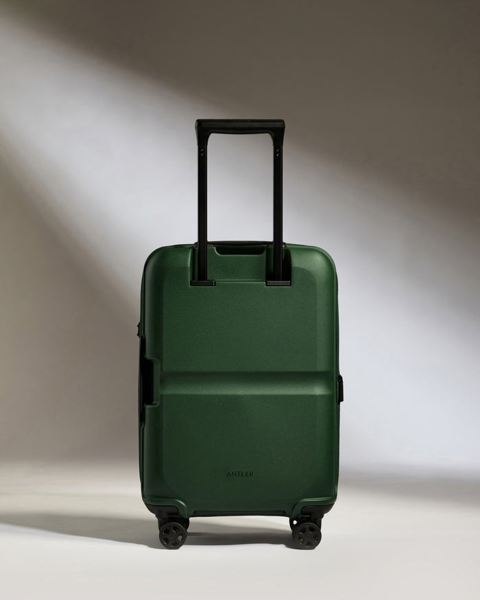 a green suitcase with wheels