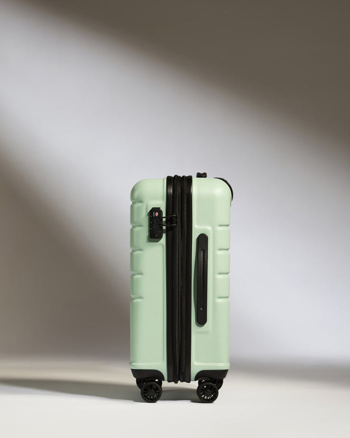 a suitcase on wheels with light on the side