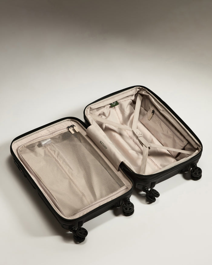 a suitcase with wheels and a mesh inside