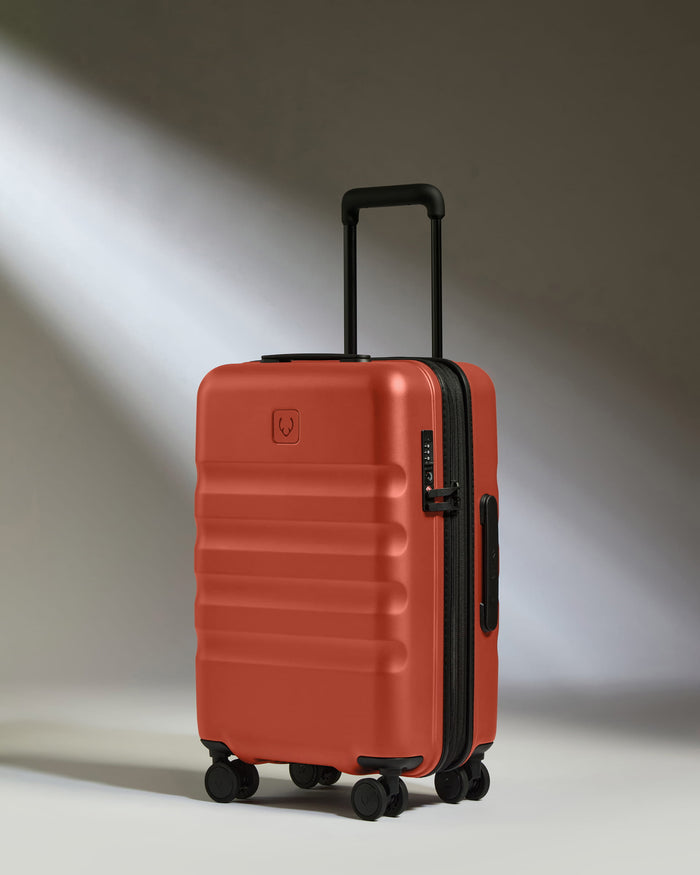 a red suitcase with wheels