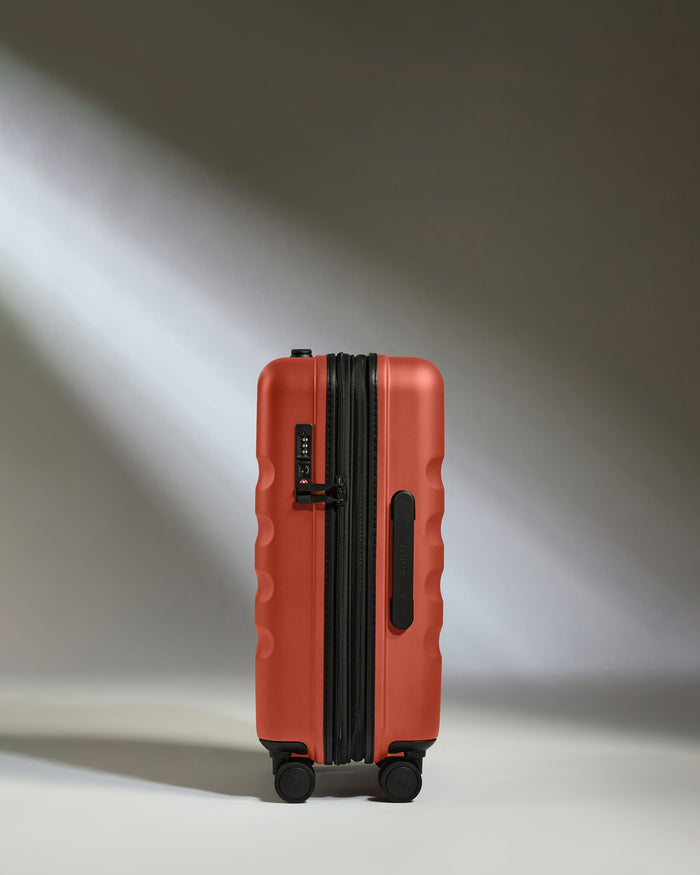 a red suitcase with wheels