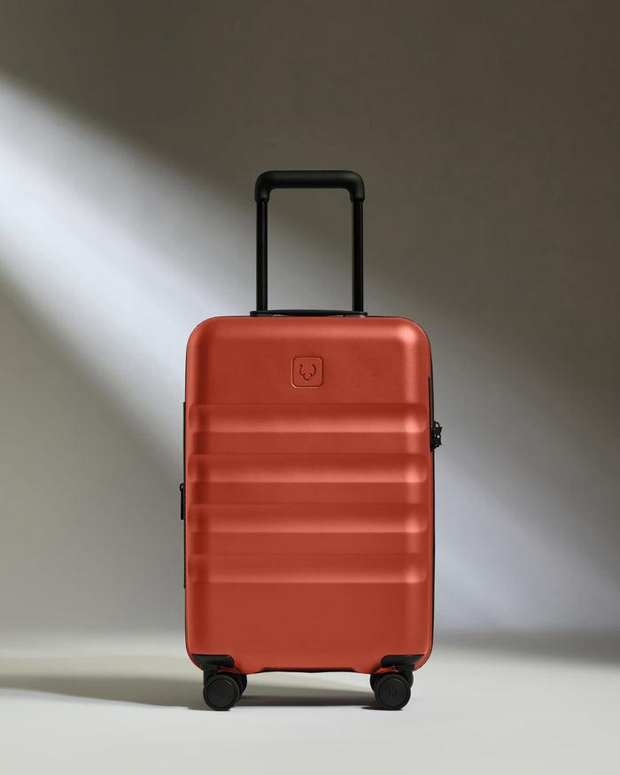 a red suitcase with wheels