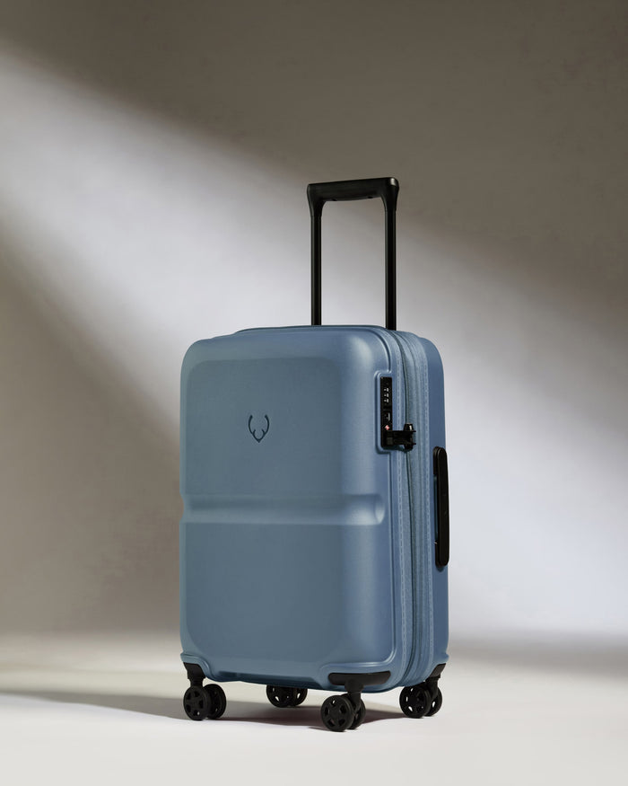 a blue suitcase with wheels