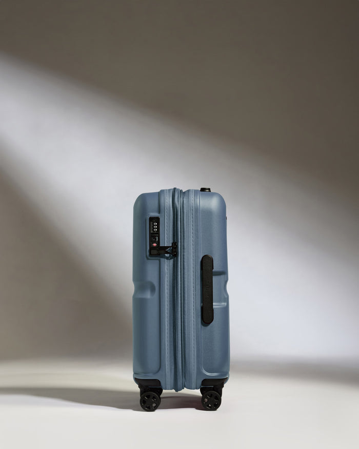 a blue suitcase with wheels