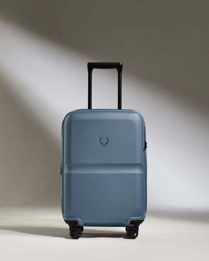 a blue suitcase with wheels