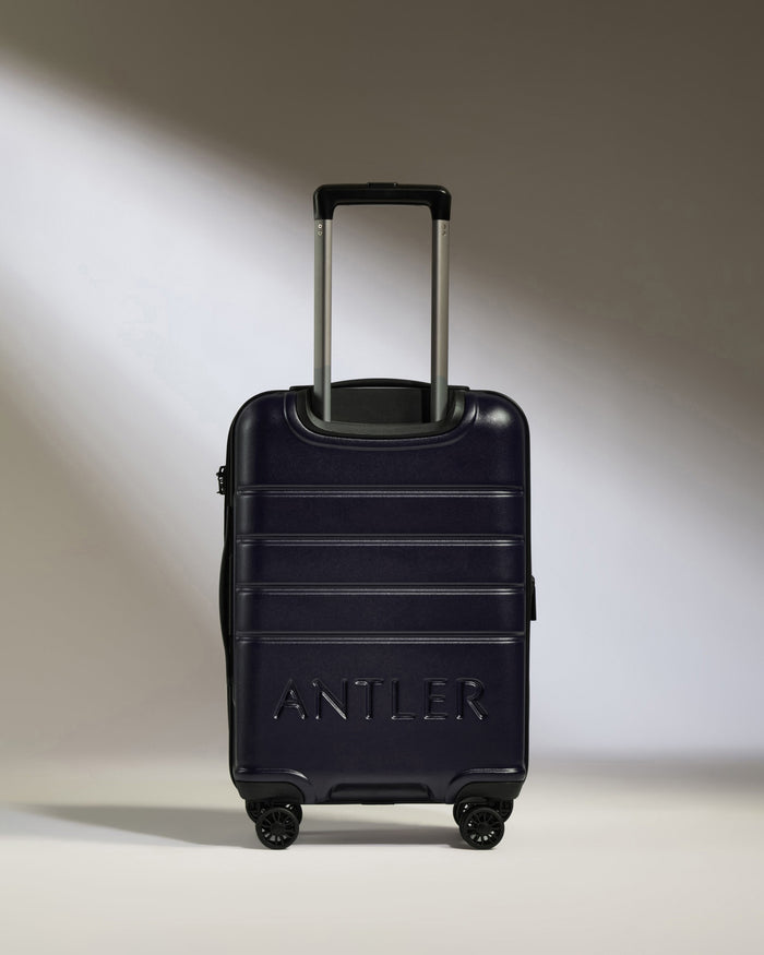 a blue suitcase with handle