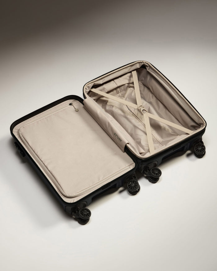 a suitcase with wheels and a tan interior