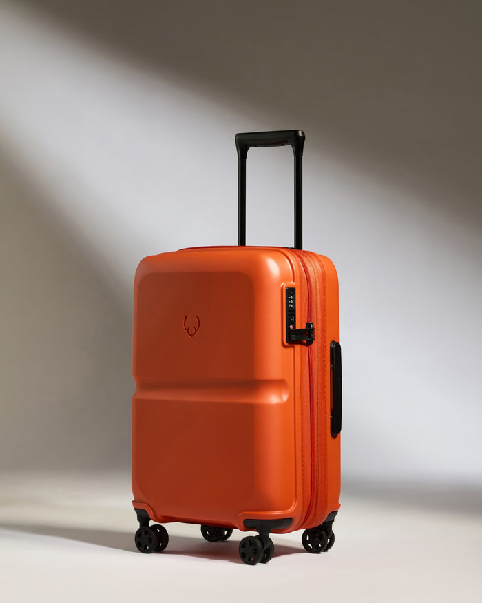 an orange suitcase with wheels