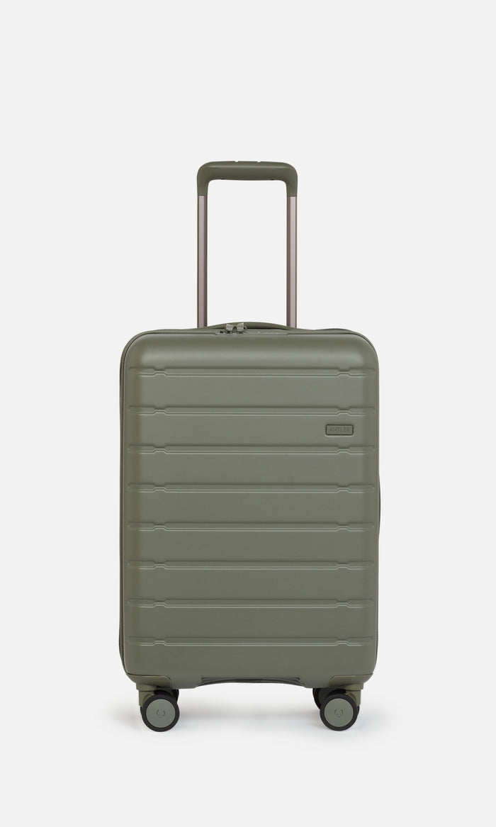 a green suitcase with handle