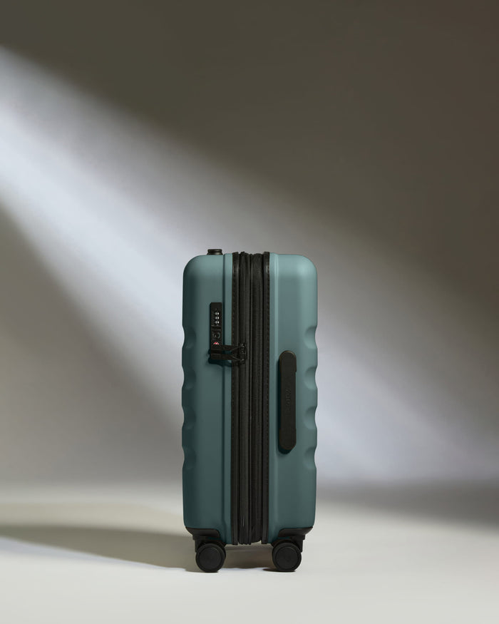 a suitcase with wheels and light shining on it