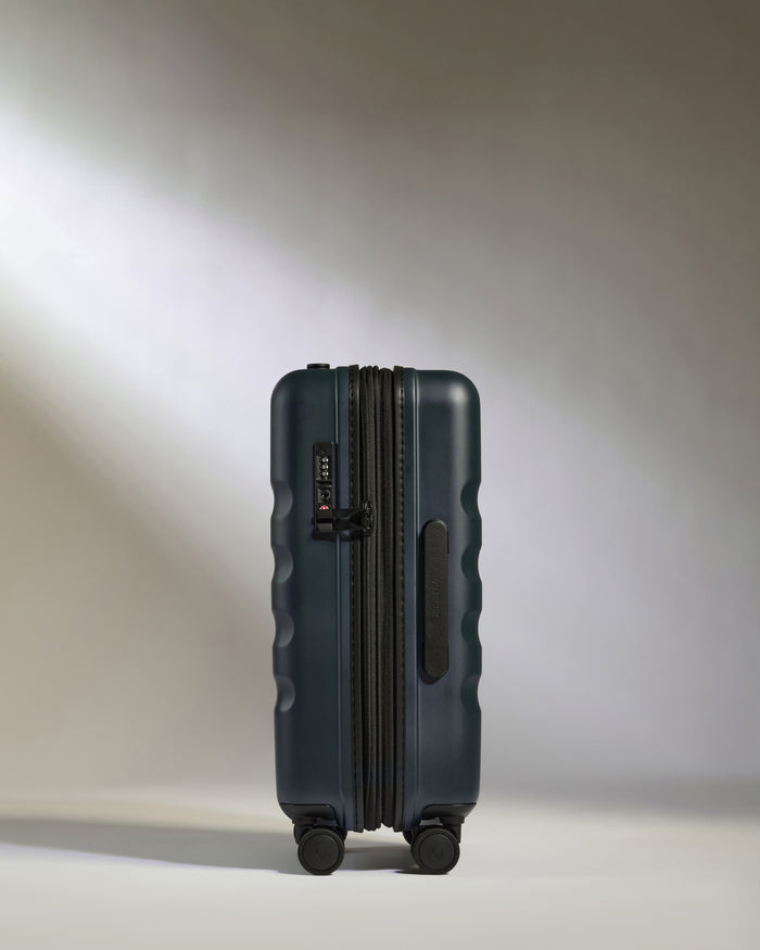 a blue suitcase with wheels
