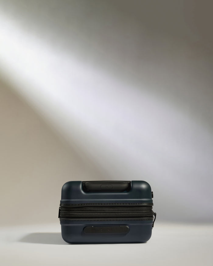a black suitcase with a black strap