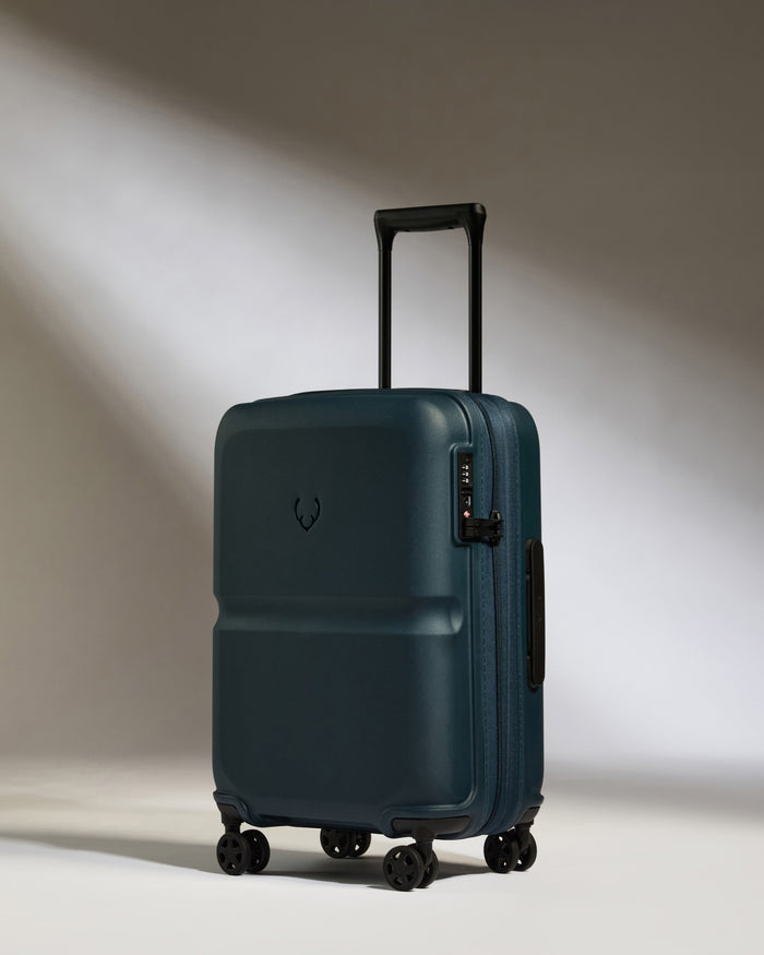 a blue suitcase with wheels