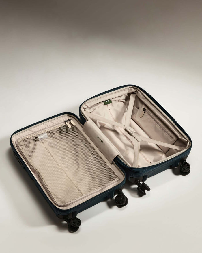 a suitcase with wheels and a mesh inside