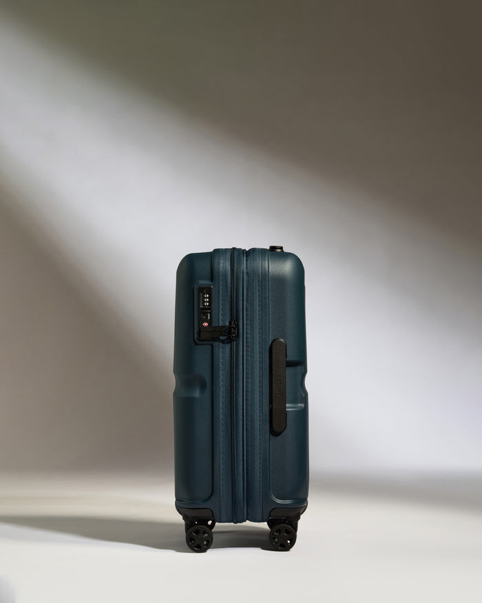 a blue suitcase with wheels