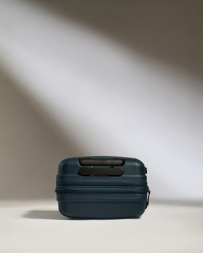 a blue suitcase with a zipper