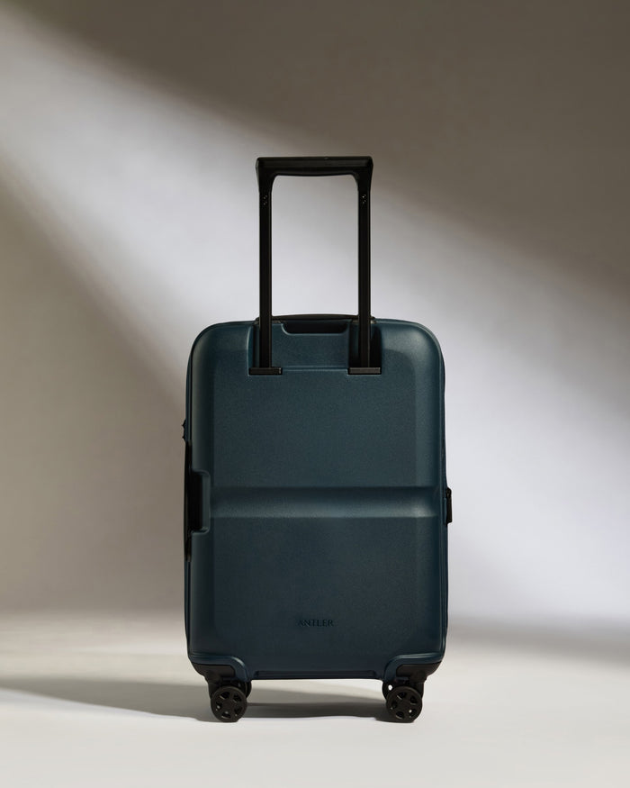 a blue suitcase with wheels