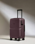 a purple suitcase with wheels
