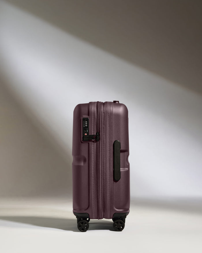 a purple suitcase with wheels