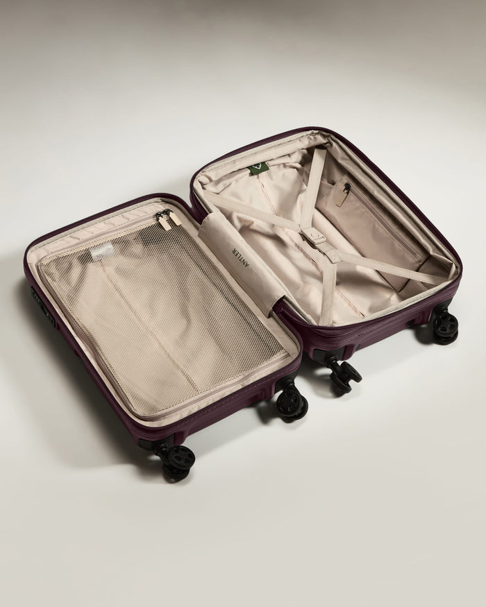 a suitcase with wheels and a mesh inside