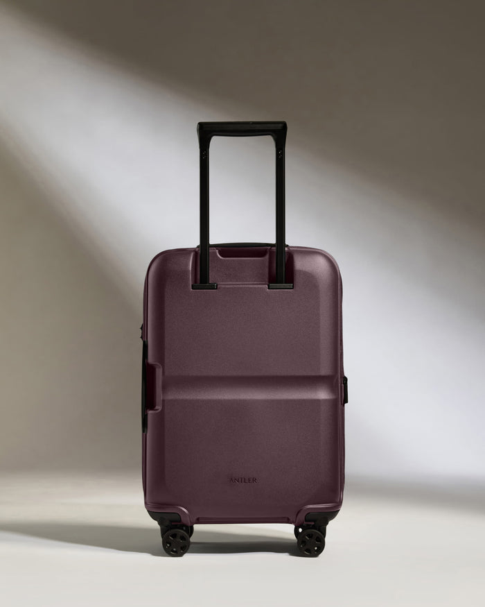 a purple suitcase with wheels