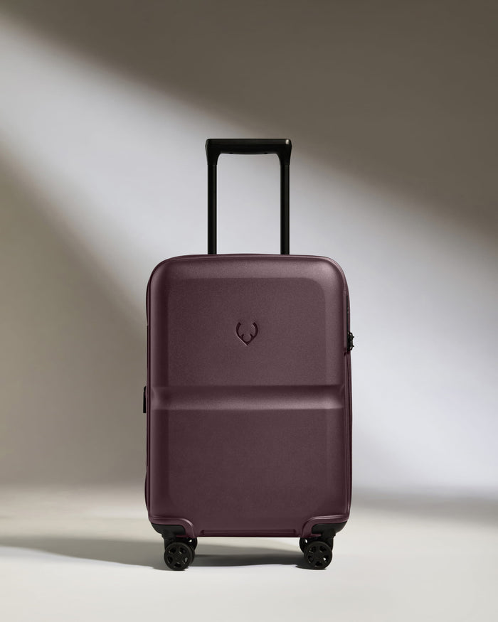 a purple suitcase with wheels