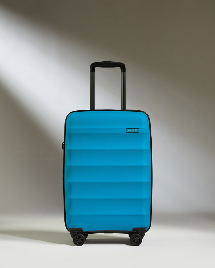 a blue suitcase with wheels